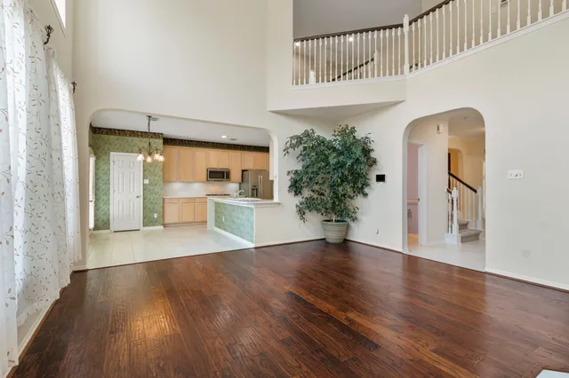 a view of an entryway with wooden floor