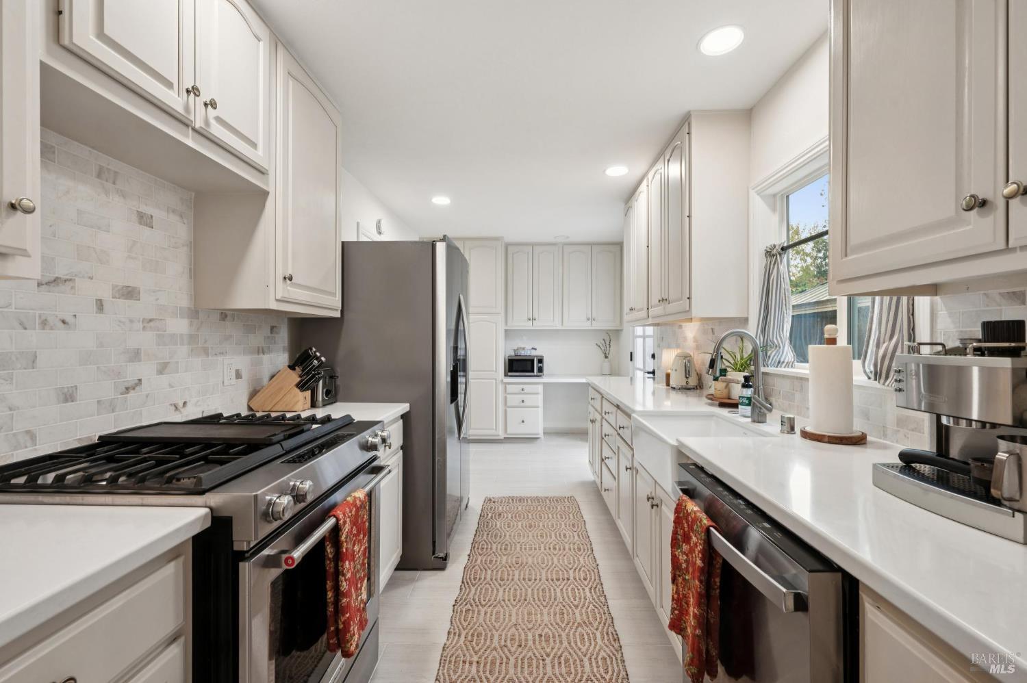 105 Corrillo Drive San Rafael, CA 94903 - Photo 11 of 33 a kitchen with stainless steel appliances a sink stove and refrigerator