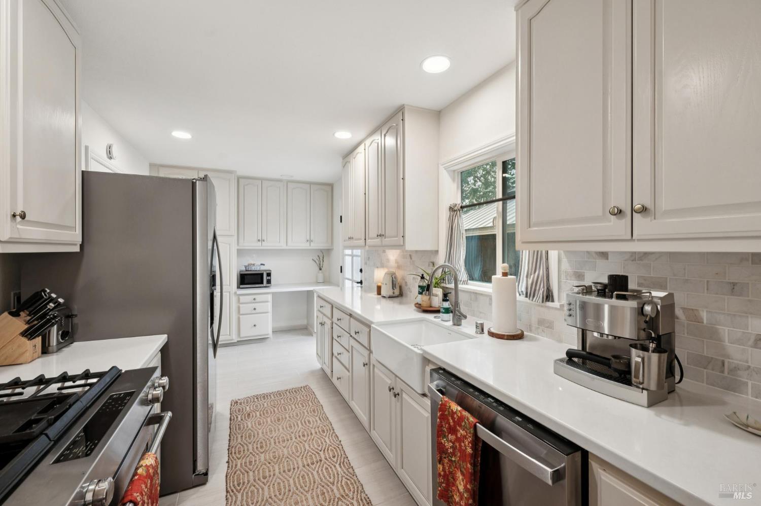 105 Corrillo Drive San Rafael, CA 94903 - Photo 12 of 33 a kitchen with refrigerator a stove and a sink
