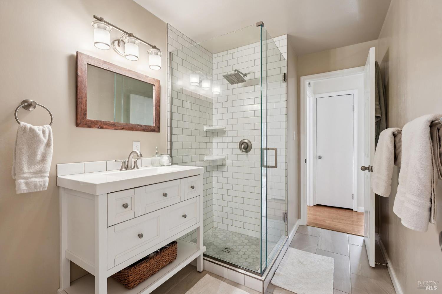 105 Corrillo Drive San Rafael, CA 94903 - Photo 16 of 33 a bathroom with a double vanity sink mirror and shower