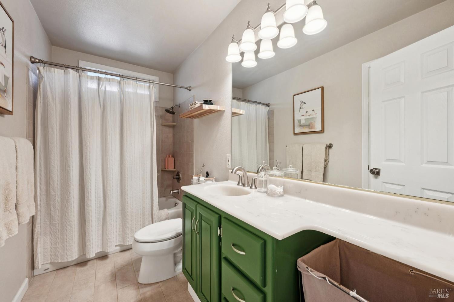 105 Corrillo Drive San Rafael, CA 94903 - Photo 21 of 33 a bathroom with a sink a toilet and a mirror