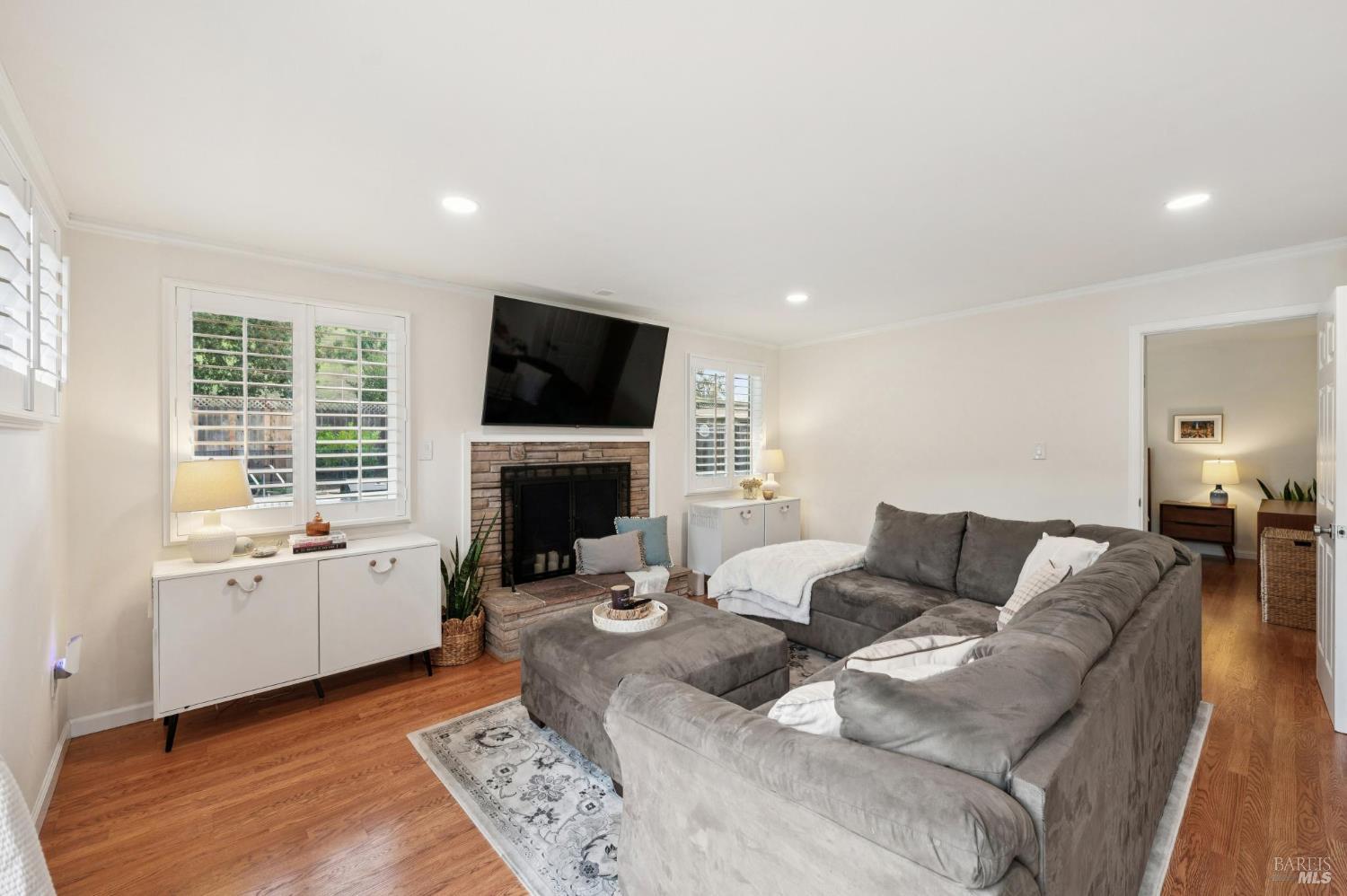 105 Corrillo Drive San Rafael, CA 94903 - Photo 9 of 33 a living room with furniture a flat screen tv and a fireplace