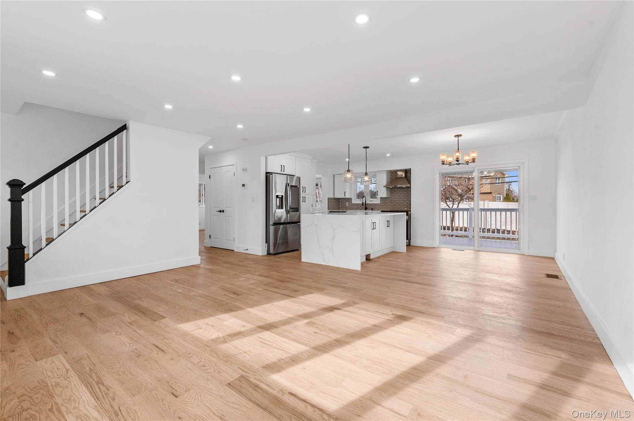 19 Hicks Avenue Syosset, NY 11791 - Photo 5 of 30 a view of a kitchen with wooden cabinet and a refrigerator