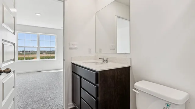 a view of an empty room and a window