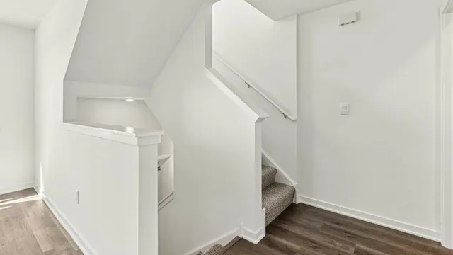 a view of entryway with wooden floor