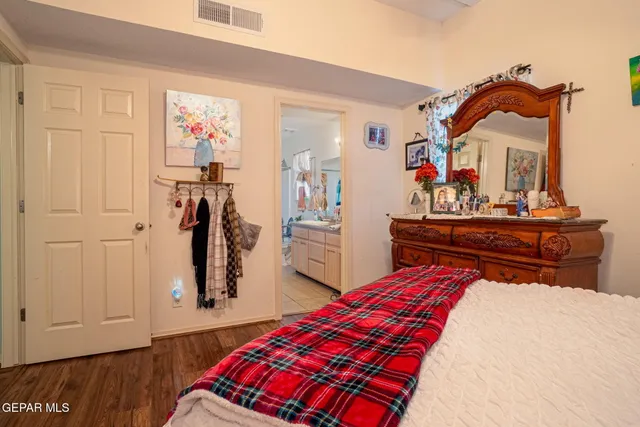 a bed room with a bed and a mirror