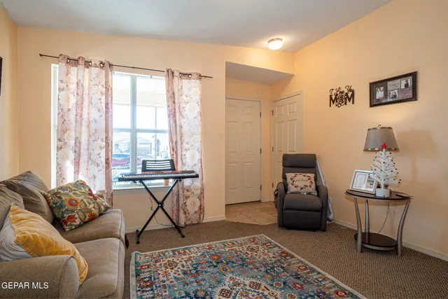 a living room with furniture and a window