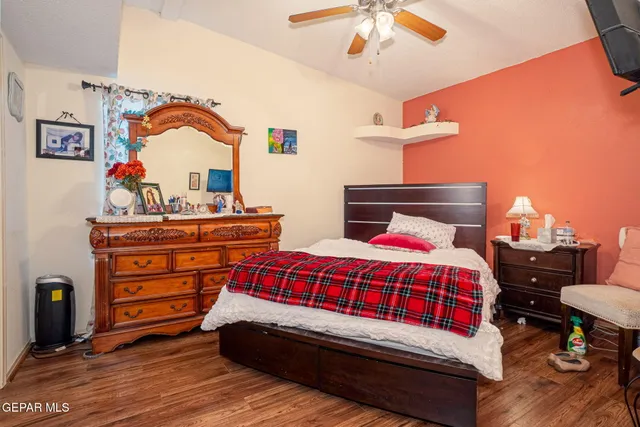 a bedroom with a bed and a dresser