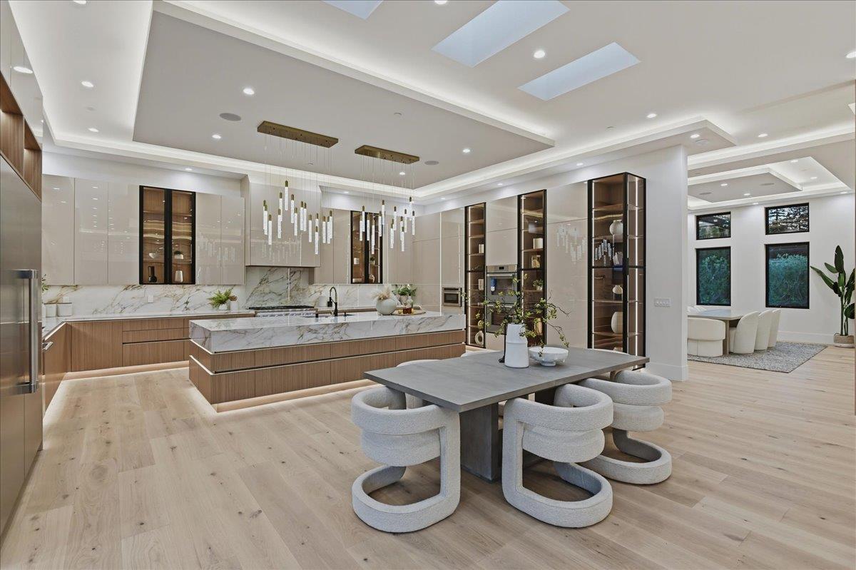 19315 San Marcos Road Saratoga, CA 95070 - Photo 13 of 52 a kitchen with a table and chairs