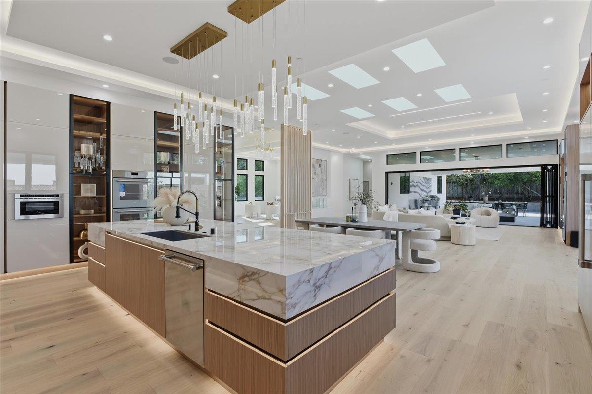19315 San Marcos Road Saratoga, CA 95070 - Photo 15 of 52 a large kitchen with stainless steel appliances a lot of counter space and a sink
