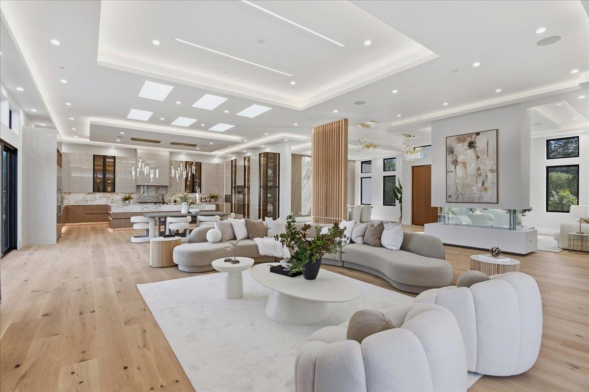 19315 San Marcos Road Saratoga, CA 95070 - Photo 22 of 52 a living room with furniture wooden floor and a large window
