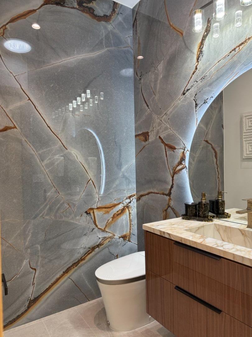 19315 San Marcos Road Saratoga, CA 95070 - Photo 25 of 52 a bathroom with a sink a toilet and a mirror