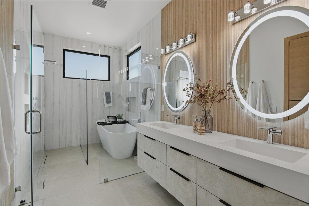 19315 San Marcos Road Saratoga, CA 95070 - Photo 28 of 52 a bathroom with a mirror a sink and a mirror