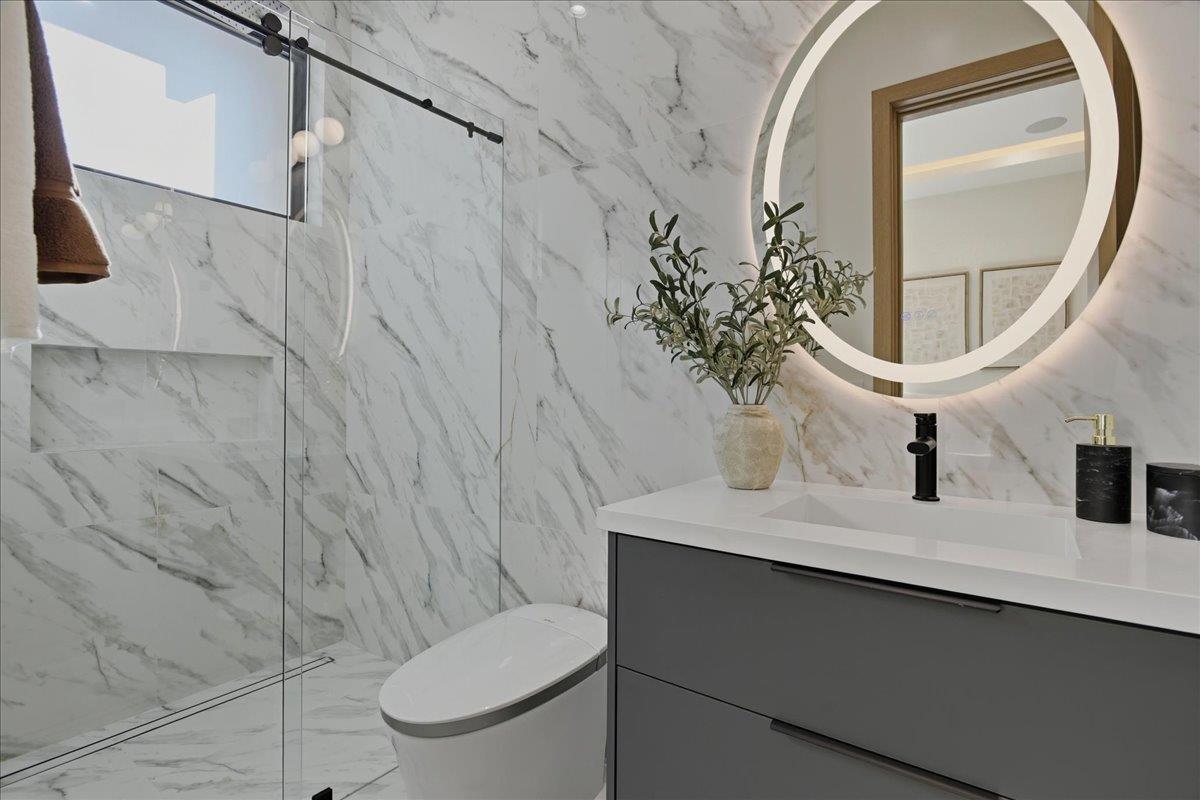19315 San Marcos Road Saratoga, CA 95070 - Photo 40 of 52 a bathroom with a sink toilet and mirror