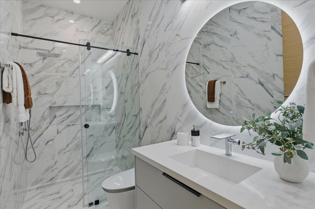 19315 San Marcos Road Saratoga, CA 95070 - Photo 42 of 52 a bathroom with a sink toilet and shower