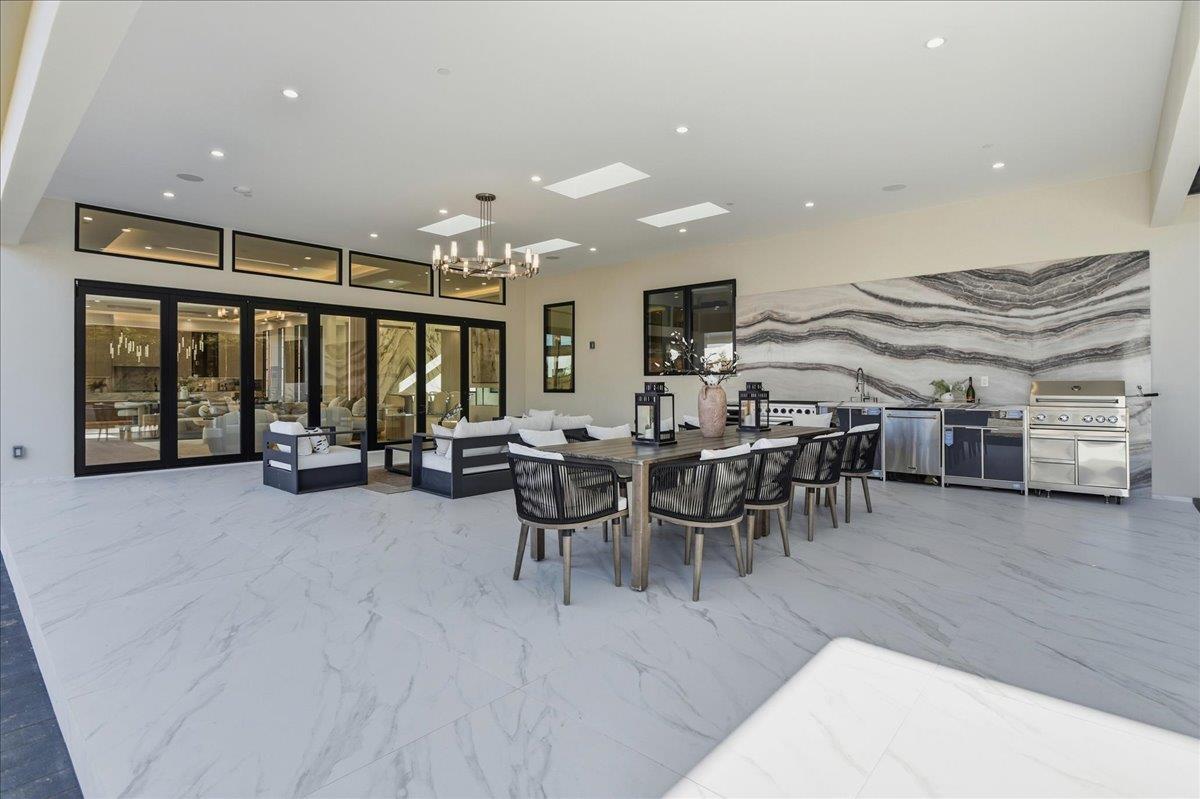 19315 San Marcos Road Saratoga, CA 95070 - Photo 45 of 52 a living room with lots of furniture and a large window