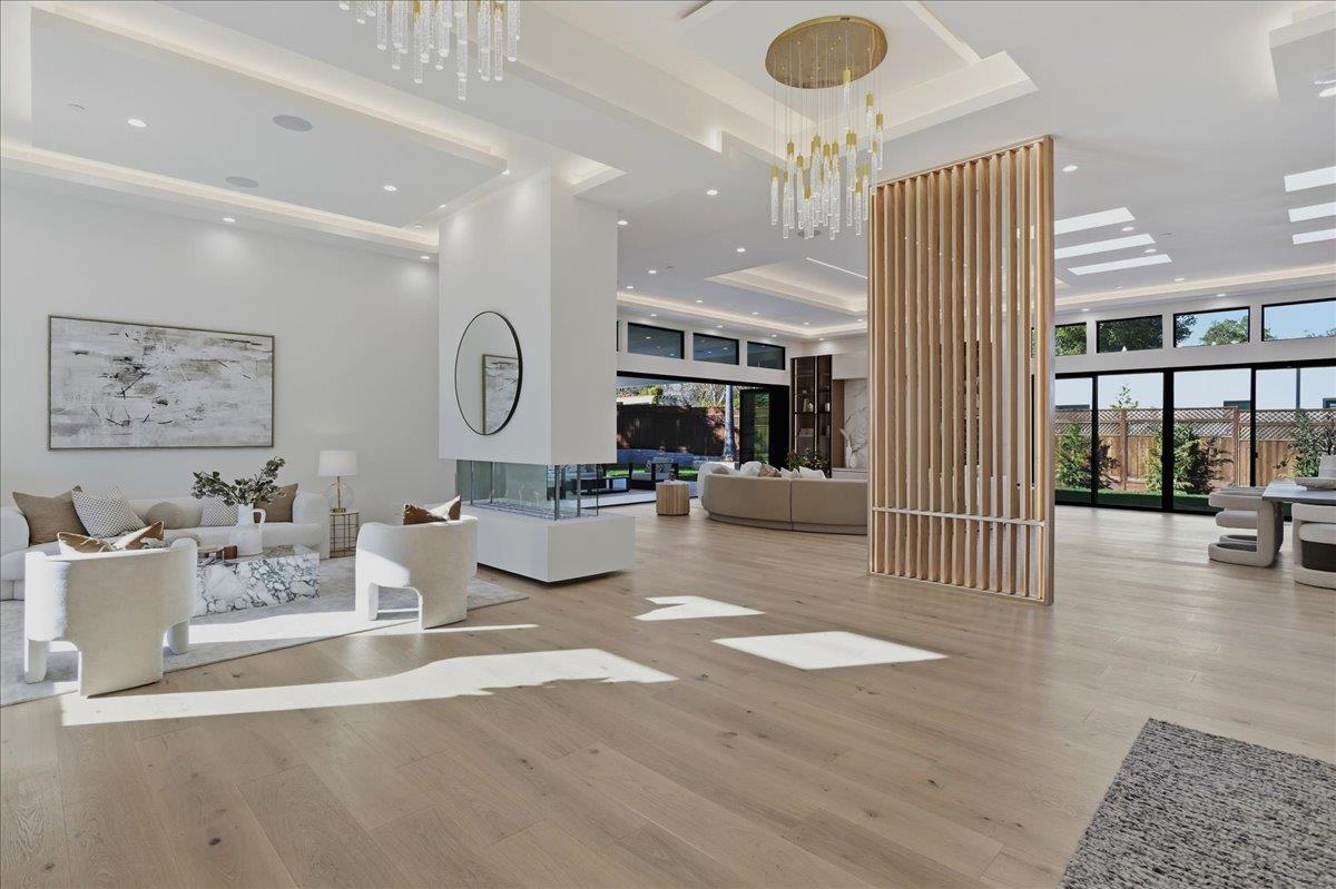 19315 San Marcos Road Saratoga, CA 95070 - Photo 10 of 52 a living room with furniture a rug and white walls