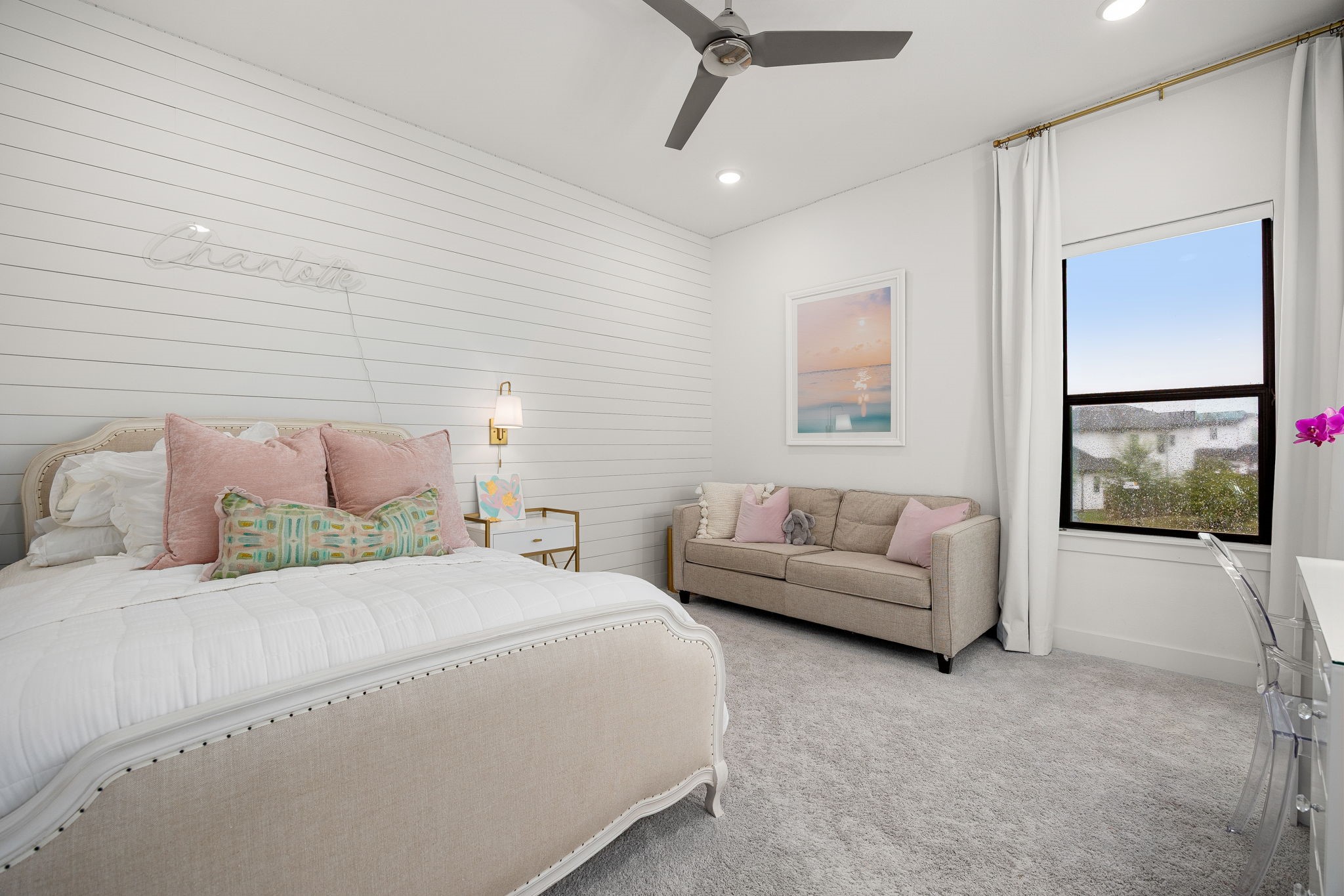 27903 Indigo Ridge Drive Fulshear, TX 77441 - Photo 31 of 50 Bright and spacious bedroom with custom shiplap accent wall, sitting area, and plenty of room to relax, study, or unwind.