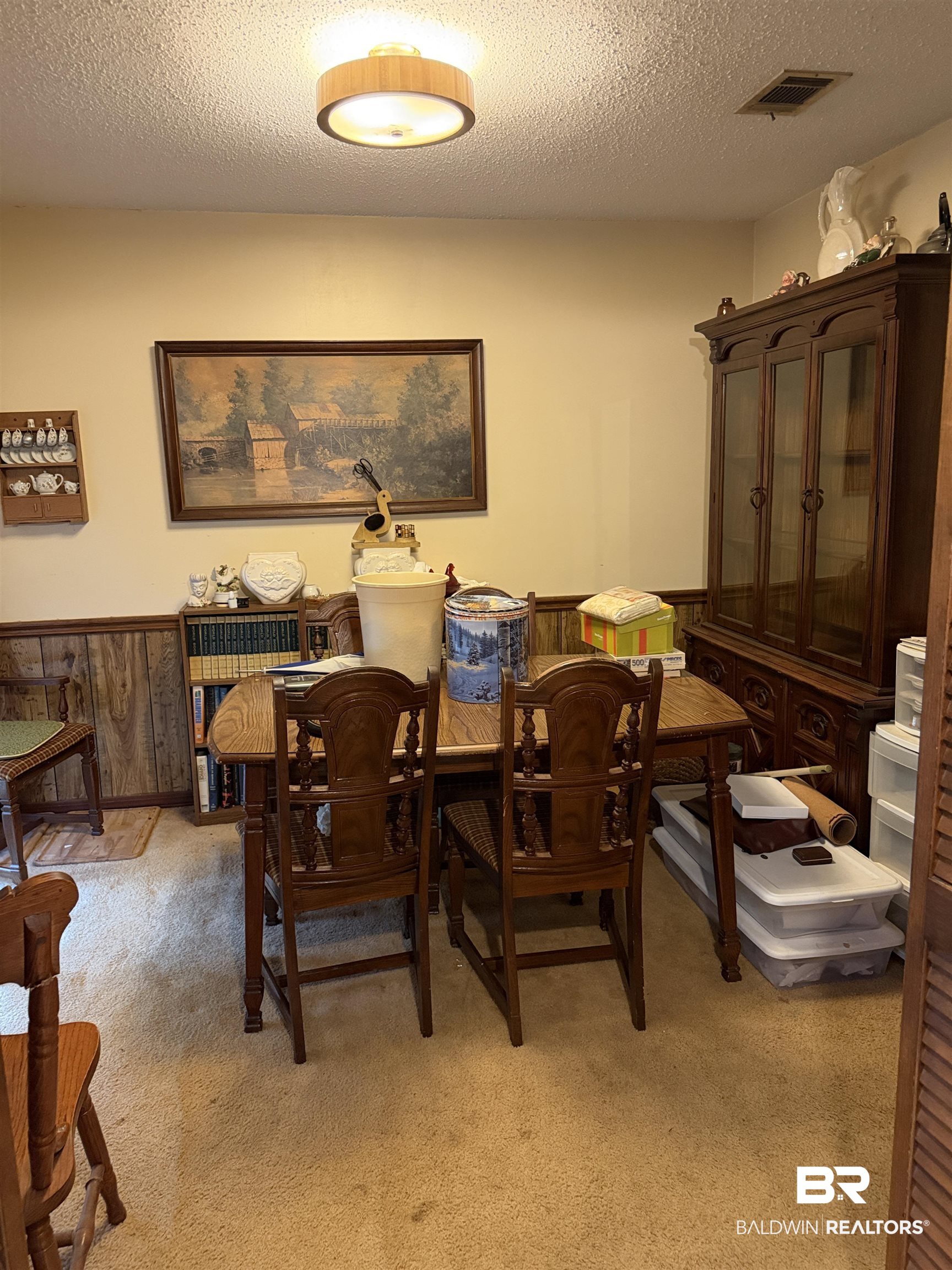 513 Club Wiley Road Jackson, AL 36545 - Photo 12 of 19 Dining area with a wainscoted wall, a textured ceiling, light colored carpet, and wooden walls