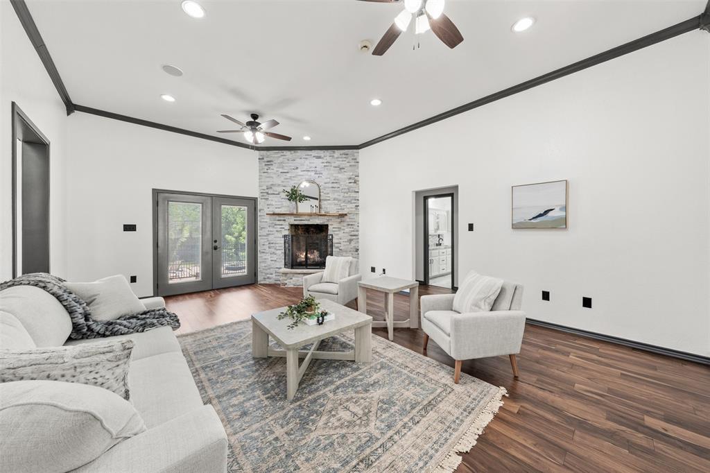 3091 Rockbridge Road McGregor, TX 76657 - Photo 15 of 40 a living room with furniture or chandelier and a wooden floor