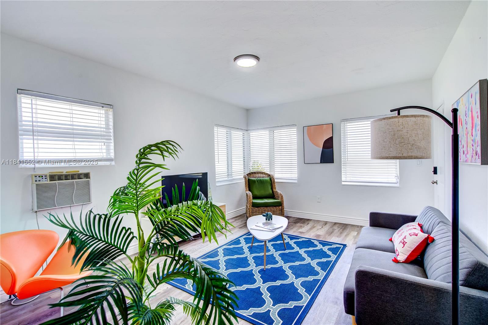 855 Southwest 7th Street, Unit 3 Miami, FL 33130 - Photo 7 of 18 a living room with furniture and a rug