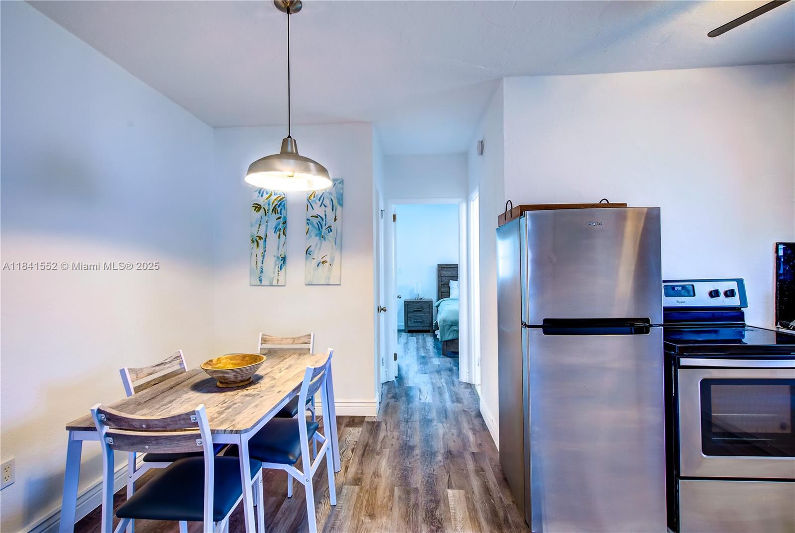 855 Southwest 7th Street, Unit 3 Miami, FL 33130 - Photo 8 of 18 a dining room with furniture and wooden floor