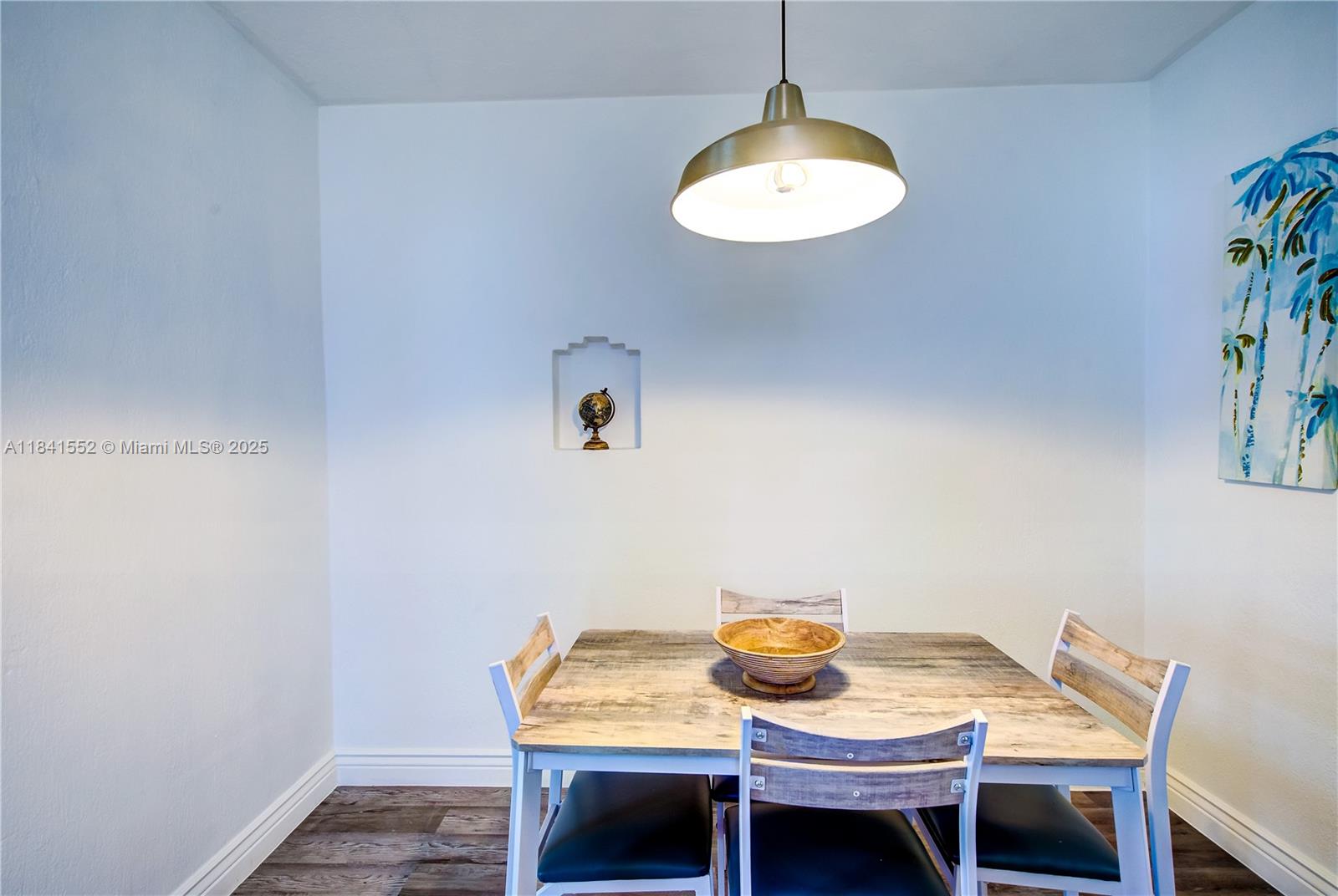 855 Southwest 7th Street, Unit 3 Miami, FL 33130 - Photo 10 of 18 a view of a dining room with furniture and wooden floor