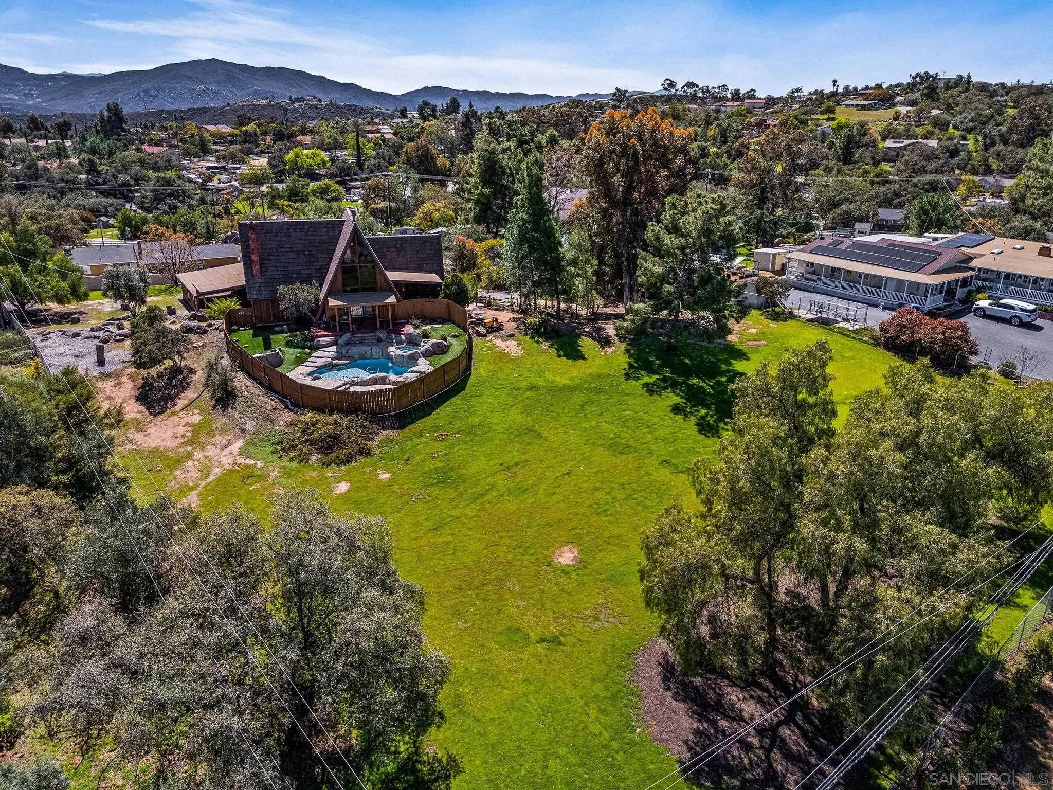1539 South Grade Road Alpine, CA 91901 - Photo 42 of 61 a view of a swimming pool with a yard and mountain view