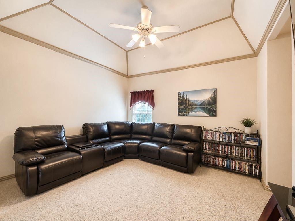 7005 Peter's Path Colleyville, TX 76034 - Photo 30 of 40 a living room with furniture a ceiling fan and a rug