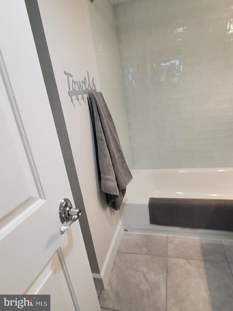 240 M Street Southwest, Unit E612 Washington, DC 20024 - Photo 13 of 17 Upgraded Shower Tile