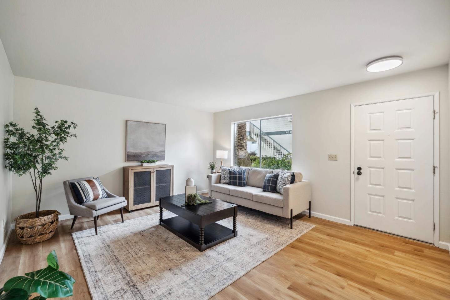 4237 Starboard Court Soquel, CA 95073 - Photo 3 of 26 a living room with furniture and a potted plant