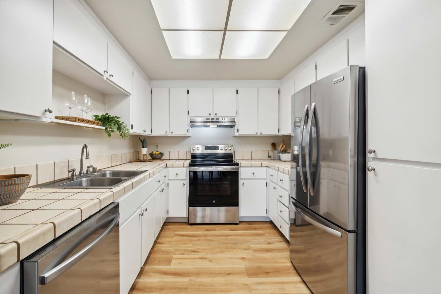 4237 Starboard Court Soquel, CA 95073 - Photo 5 of 26 a kitchen with stainless steel appliances granite countertop a refrigerator a sink a stove and a refrigerator