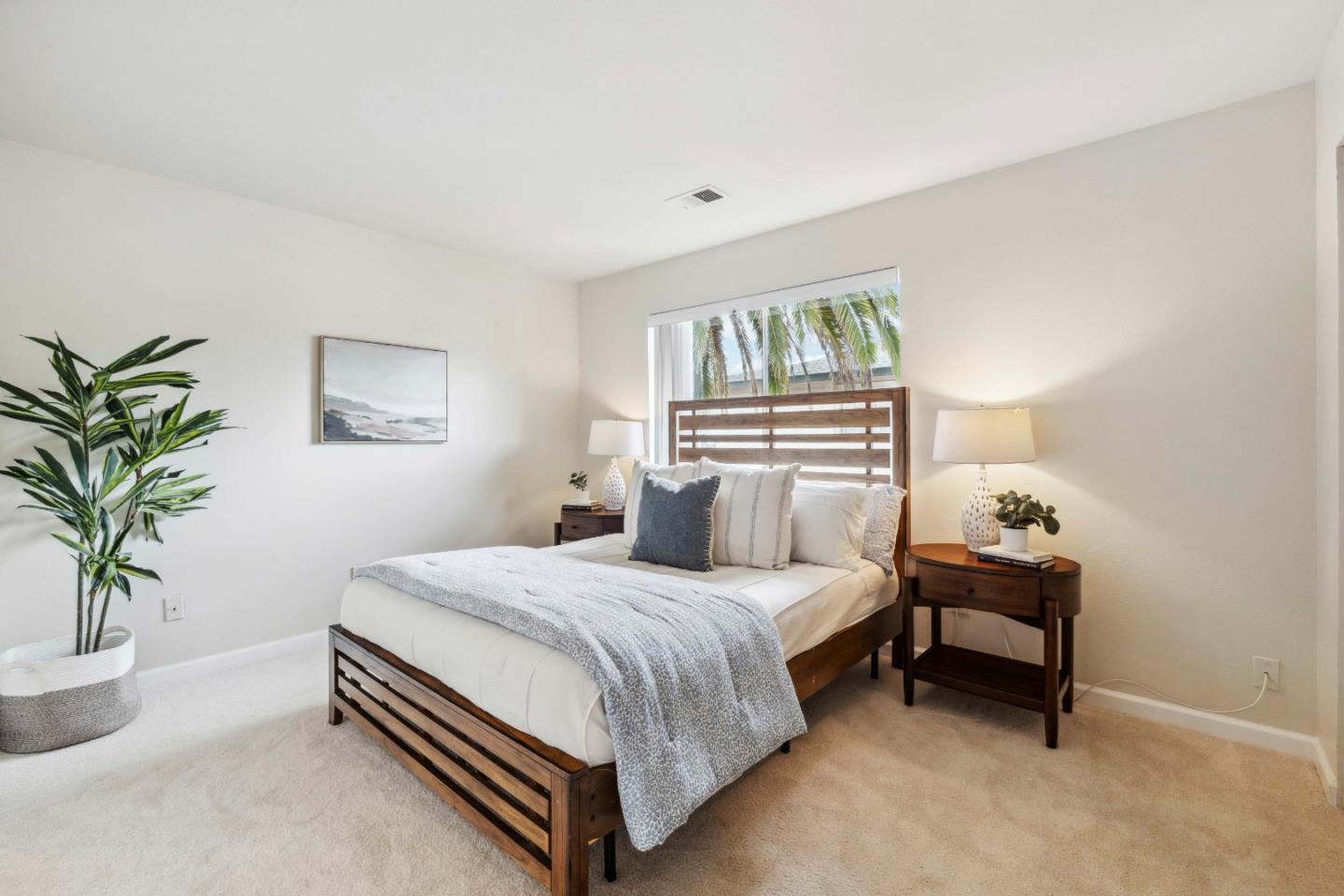 4237 Starboard Court Soquel, CA 95073 - Photo 6 of 26 a bedroom with a bed and a potted plant on the dresser