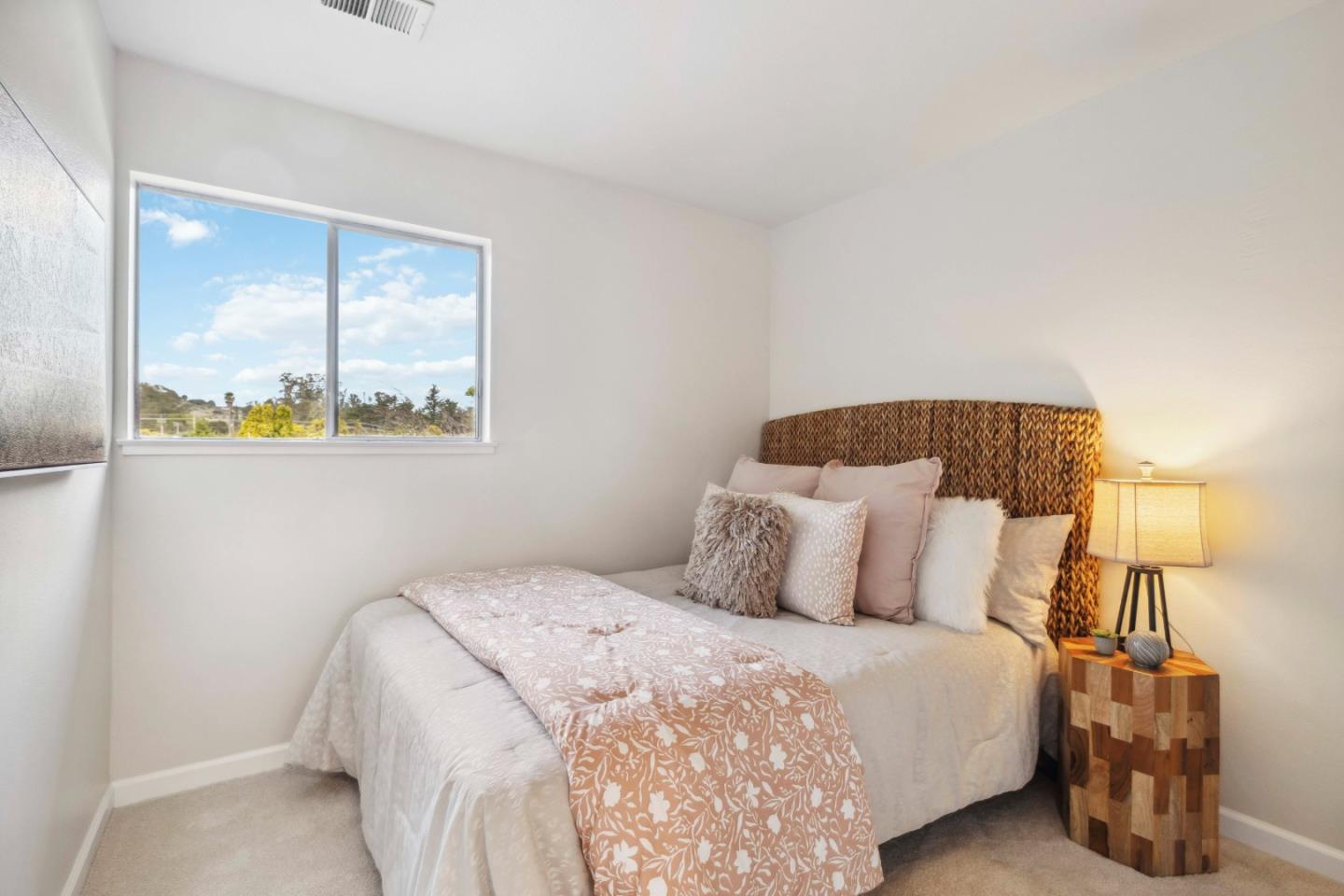 4237 Starboard Court Soquel, CA 95073 - Photo 8 of 26 a bedroom with a bed and lamp