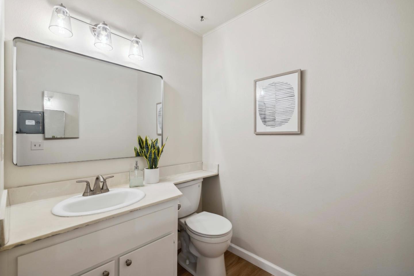 4237 Starboard Court Soquel, CA 95073 - Photo 10 of 26 a bathroom with a toilet sink and mirror