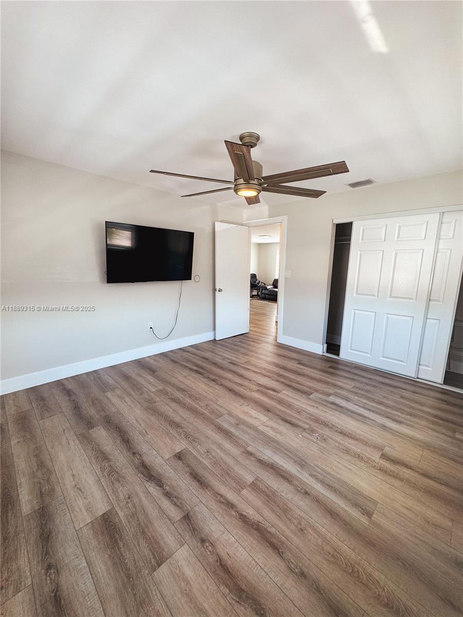 851 East 17th Street, Unit B Hialeah, FL 33010 - Photo 9 of 13 a view of a livingroom with a flat screen tv