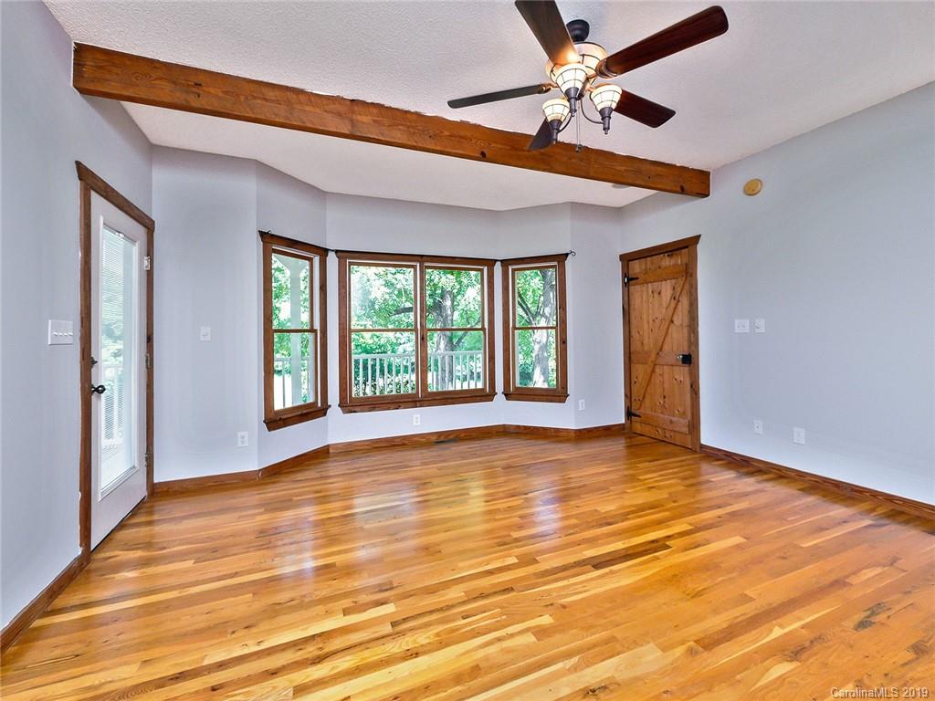 3450 Center Road Chester, SC 29706 - Photo 22 of 47 a view of an empty room with window and chandelier fan