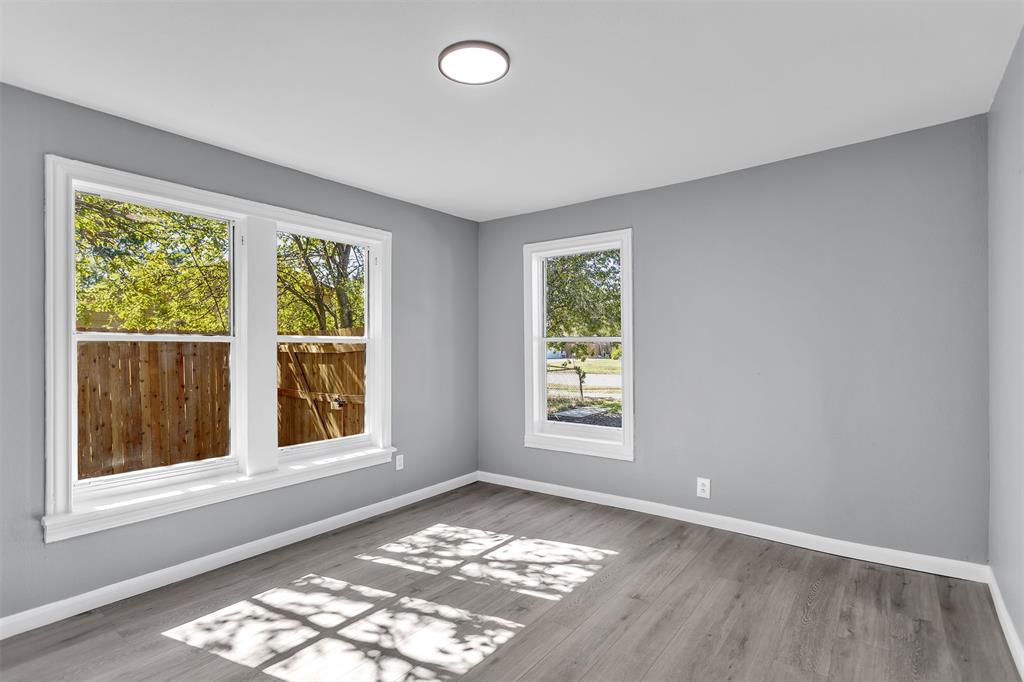 904 North Virginia Street Terrell, TX 75160 - Photo 13 of 22 an empty room with windows