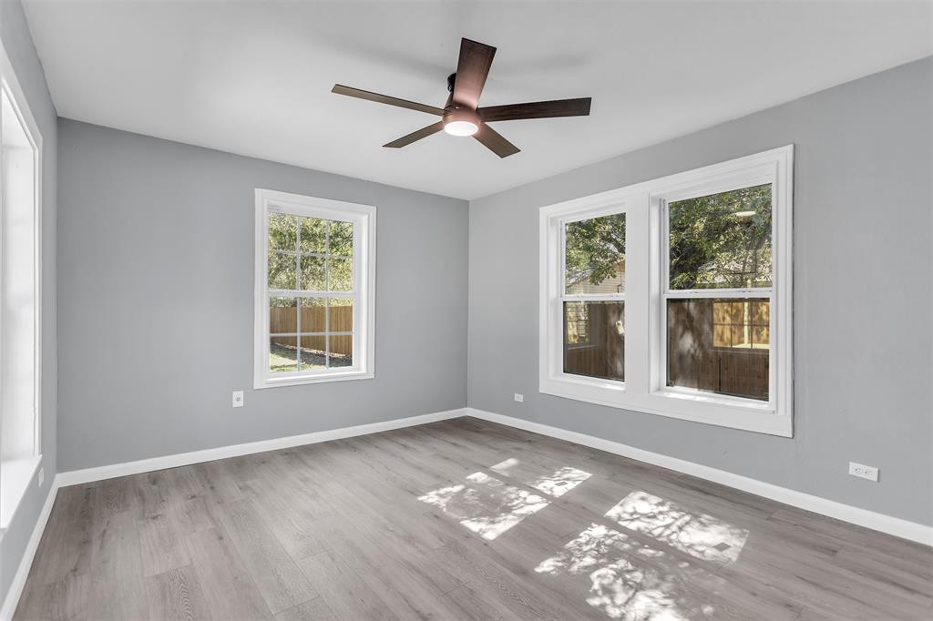 904 North Virginia Street Terrell, TX 75160 - Photo 18 of 22 a view of an empty room with a window and wooden floor