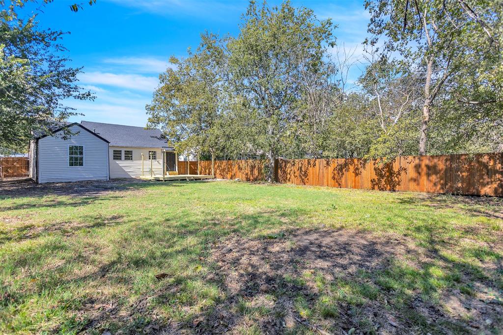 904 North Virginia Street Terrell, TX 75160 - Photo 22 of 22 a view of a house with yard and tree s