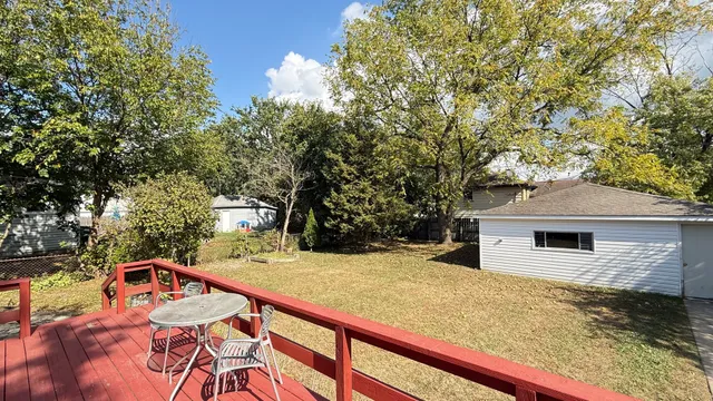 a view of a house with large trees