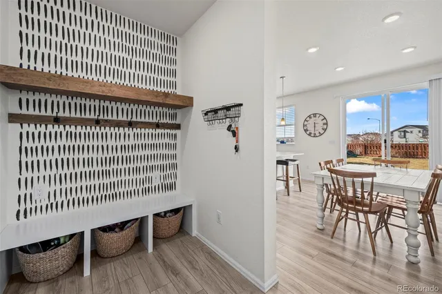 a view of a dining room with furniture and wooden floor