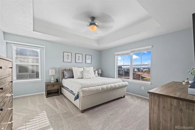 a spacious bedroom with a large bed and a window