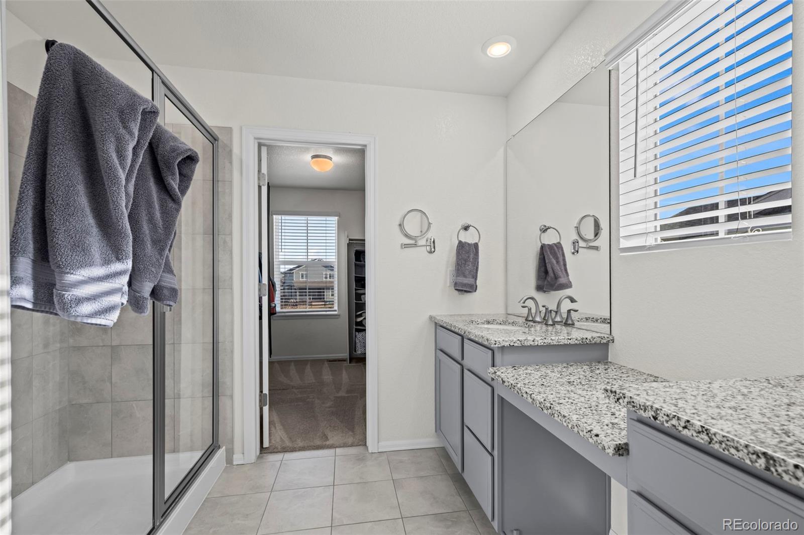 10985 Wheeling Street Commerce City, CO 80022 - Photo 15 of 45 a kitchen with stainless steel appliances granite countertop a refrigerator and a sink
