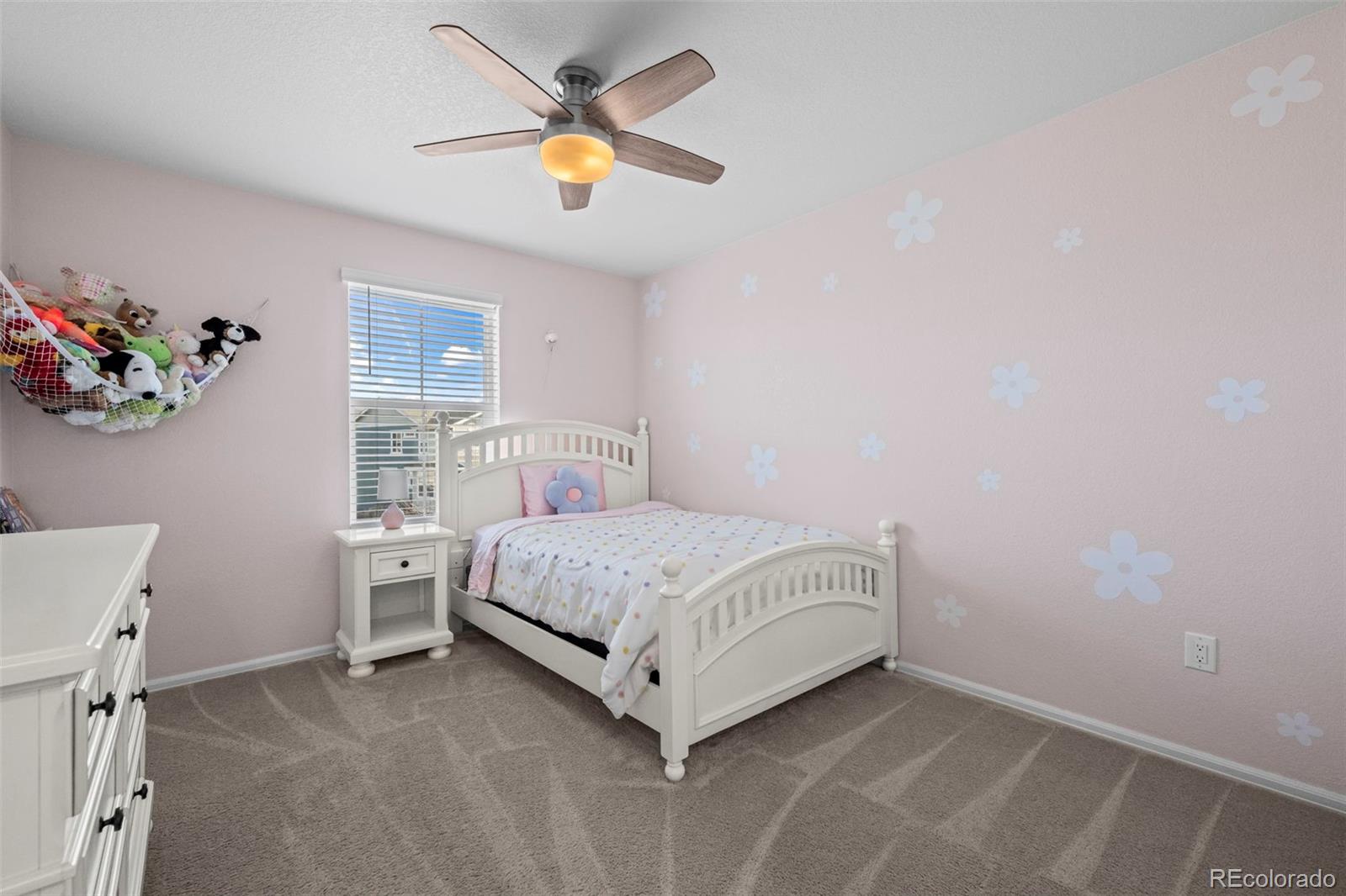 10985 Wheeling Street Commerce City, CO 80022 - Photo 17 of 45 a bedroom with a bed and a window