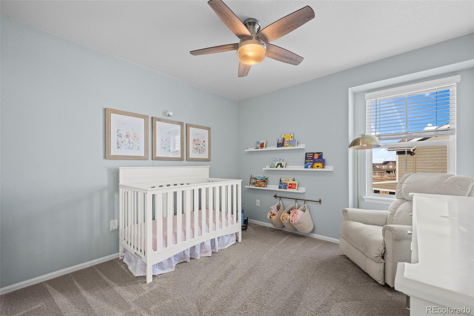 10985 Wheeling Street Commerce City, CO 80022 - Photo 18 of 45 a bedroom with a bed and a window