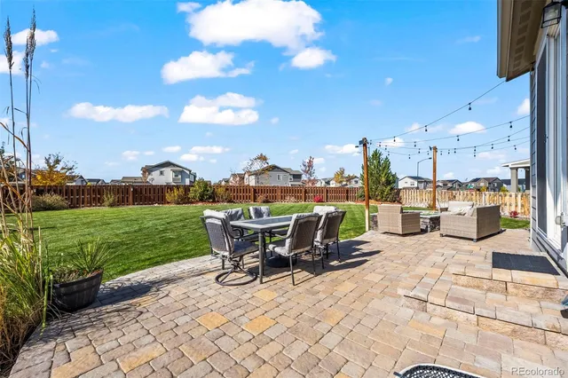 a view of a patio with couches chairs dining table and chairs