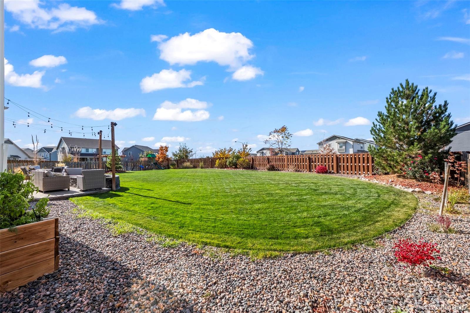 10985 Wheeling Street Commerce City, CO 80022 - Photo 26 of 45 a view of a garden with a house