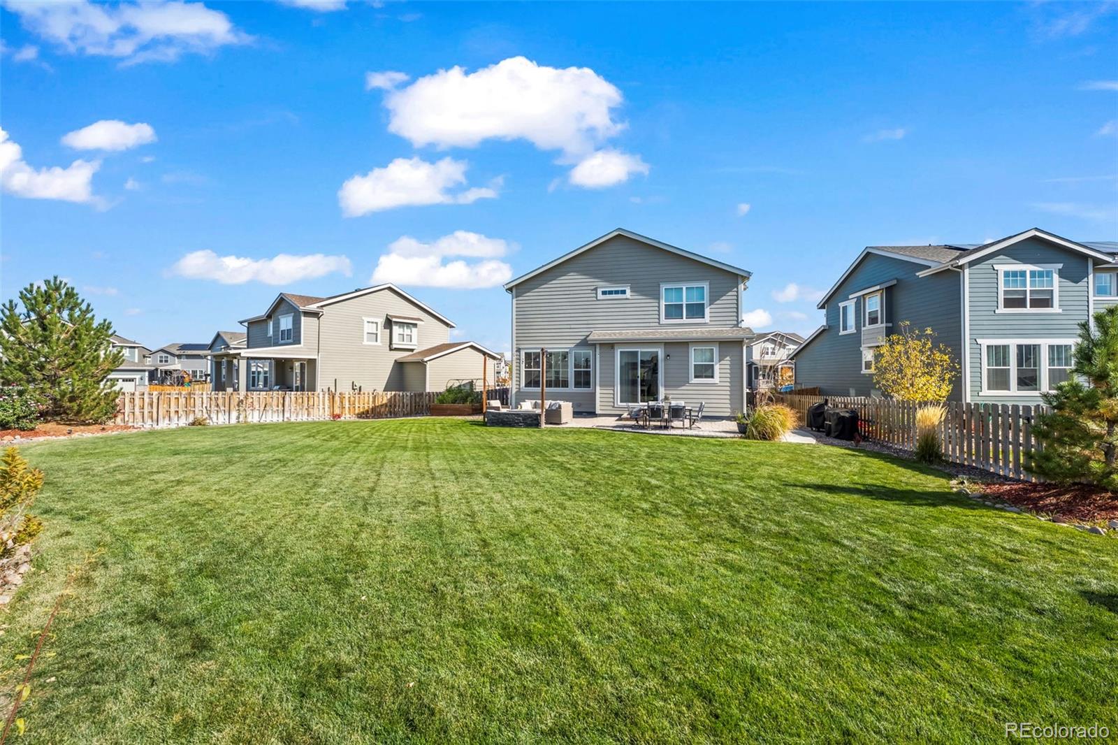 10985 Wheeling Street Commerce City, CO 80022 - Photo 29 of 45 a front view of a house with a garden