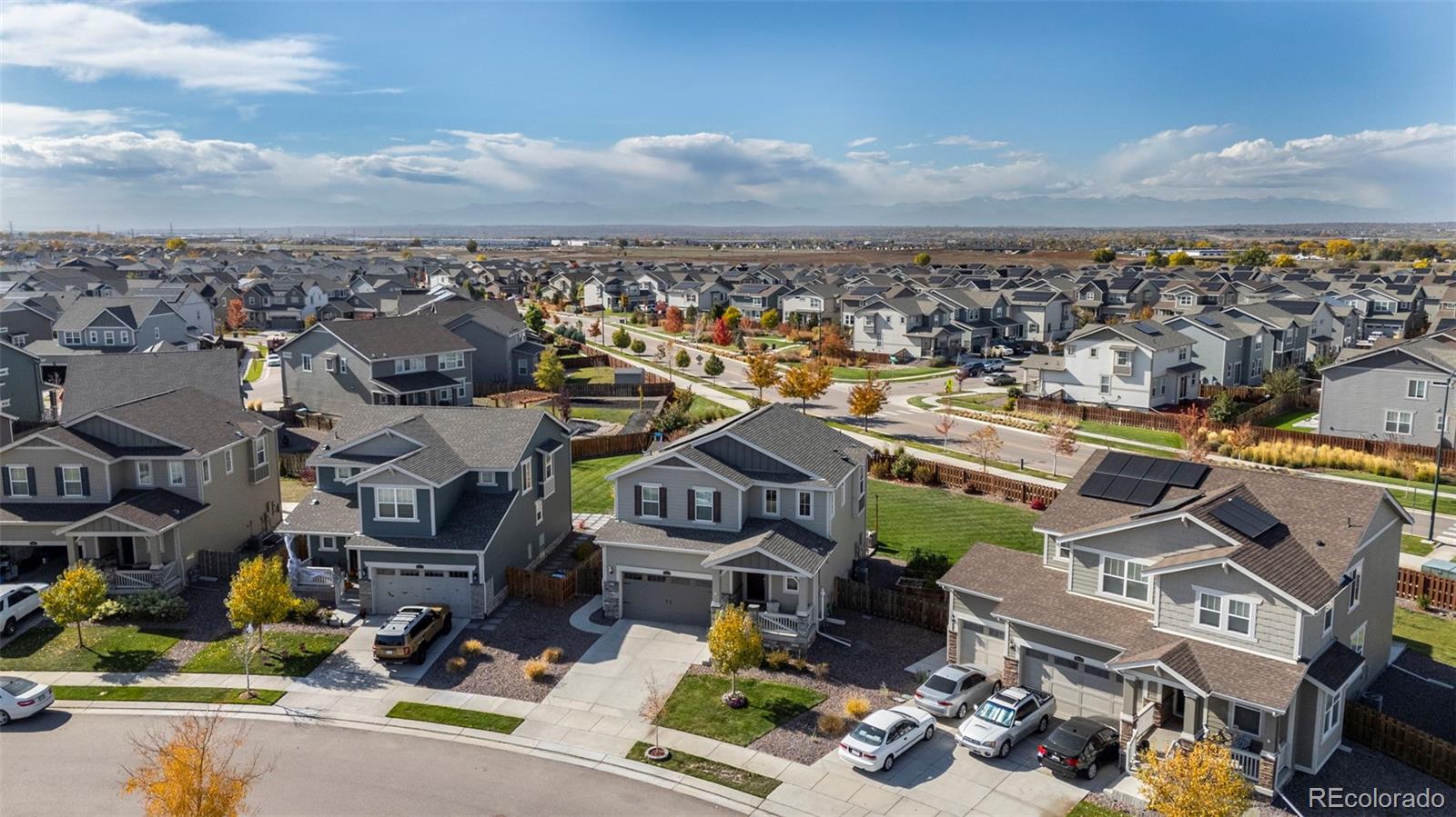 10985 Wheeling Street Commerce City, CO 80022 - Photo 31 of 45 an aerial view of a house with big yard and large tree